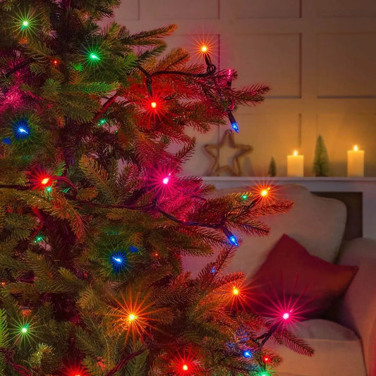 NOMA multicoloured LED string lights on a Christmas tree