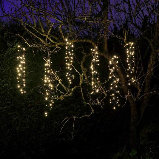 NOMA warm white cascading lights hanging on a tree