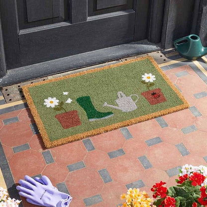 Flower pots gardening coir doormat with wellington boot and watering can design on a tiled step
