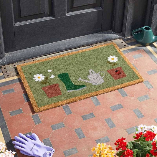 Flower pots gardening coir doormat with wellington boot and watering can design on a tiled step