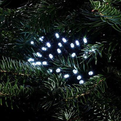 close up shot of NOMA cool white LED string lights in a cluster on a Christmas tree