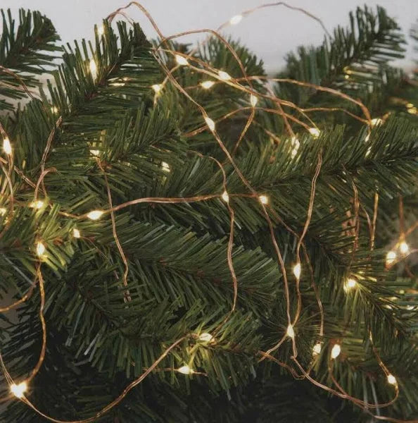 close up shot of NOMA warm white copper wire LED lights on a Christmas tree