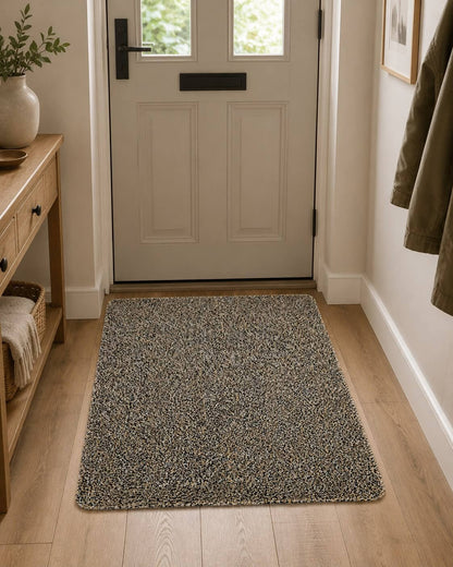 Mocha Ulti-Mat washable indoor doormat in a hallway entryway by a front door