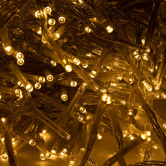Close up image of warm white cluster lights with clear cable
