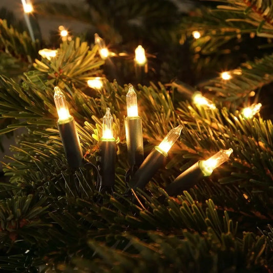 String of warm white fairy lights on a Christmas tree